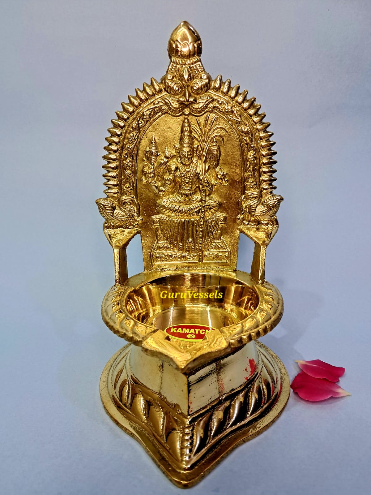 "Traditional brass Kamatchi Amman lamp for pooja rituals"